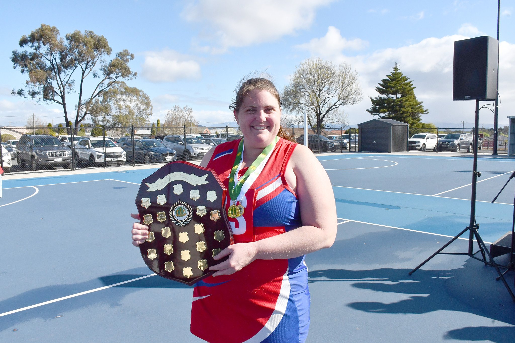 Fulton with the shield and her best on the court medal. PHOTO: CHRIS GRAETZ