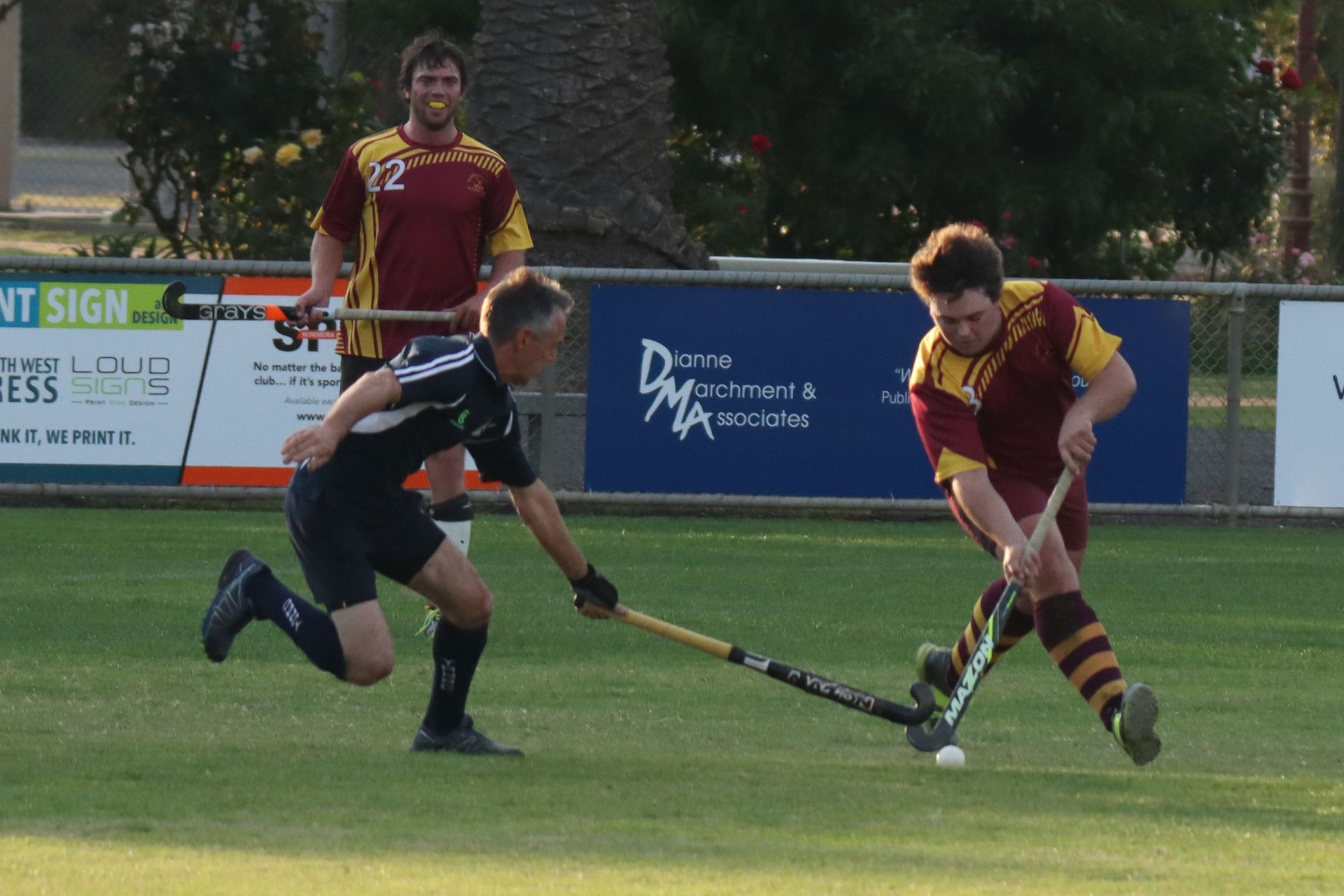 Oskar Bennet (Hoops) runs with the ball while Simon Farmers (Tigers) attempts to slow his progress.