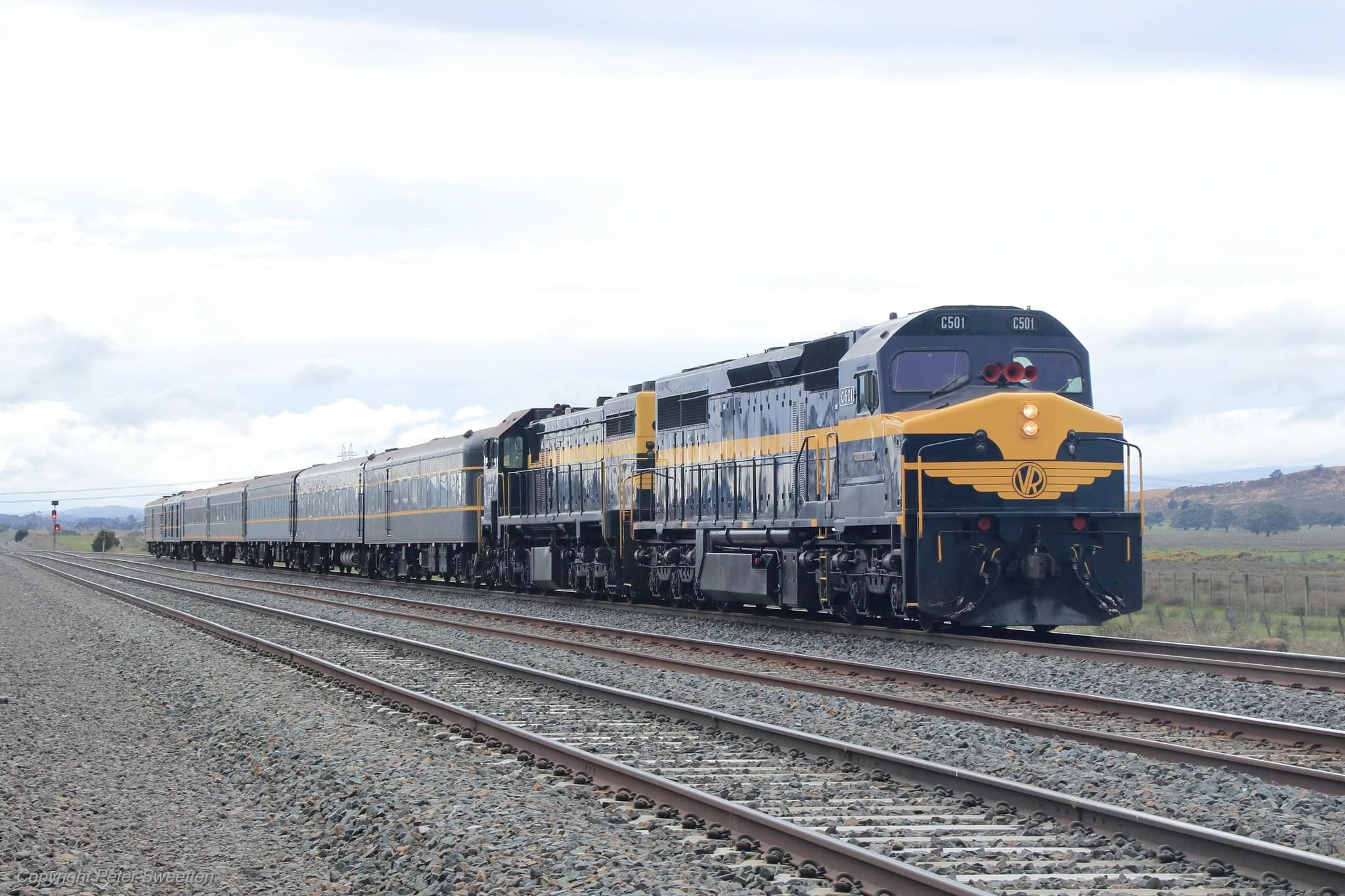 The two heritage diesel locomotives pulling original Spirit of Progress cars.