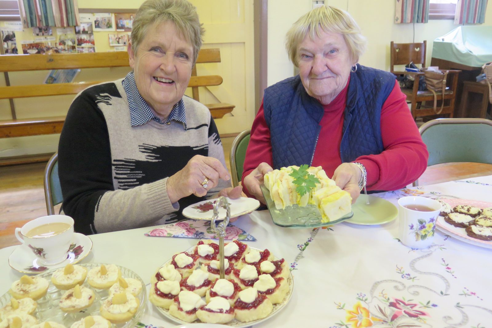 Elainie Nitschke and Lauris Bretag wondering which of the yummy food items to choose first at the Rainbow Ladies Fellowship high tea. Photo: SUSAN PEARSE