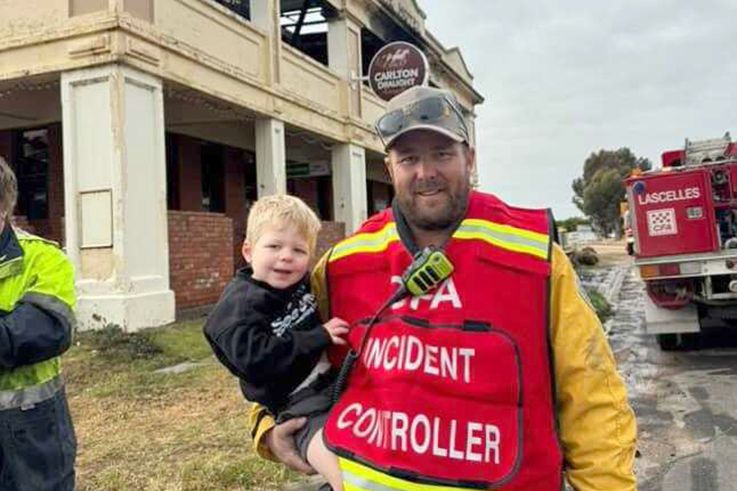 Daniel Floyd with his and Tenae Mott's son Kade, the morning after the fire at Minapre. Tenae is devastated Kade will never get to experience the pub like she did growing up.
