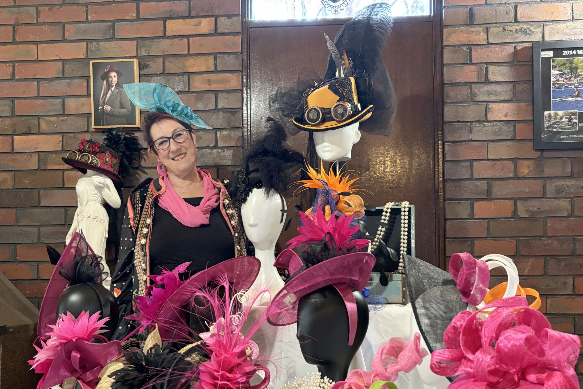 Hats by Pollyanna owner Pauline Thomson in the display room with a selection of her designs.