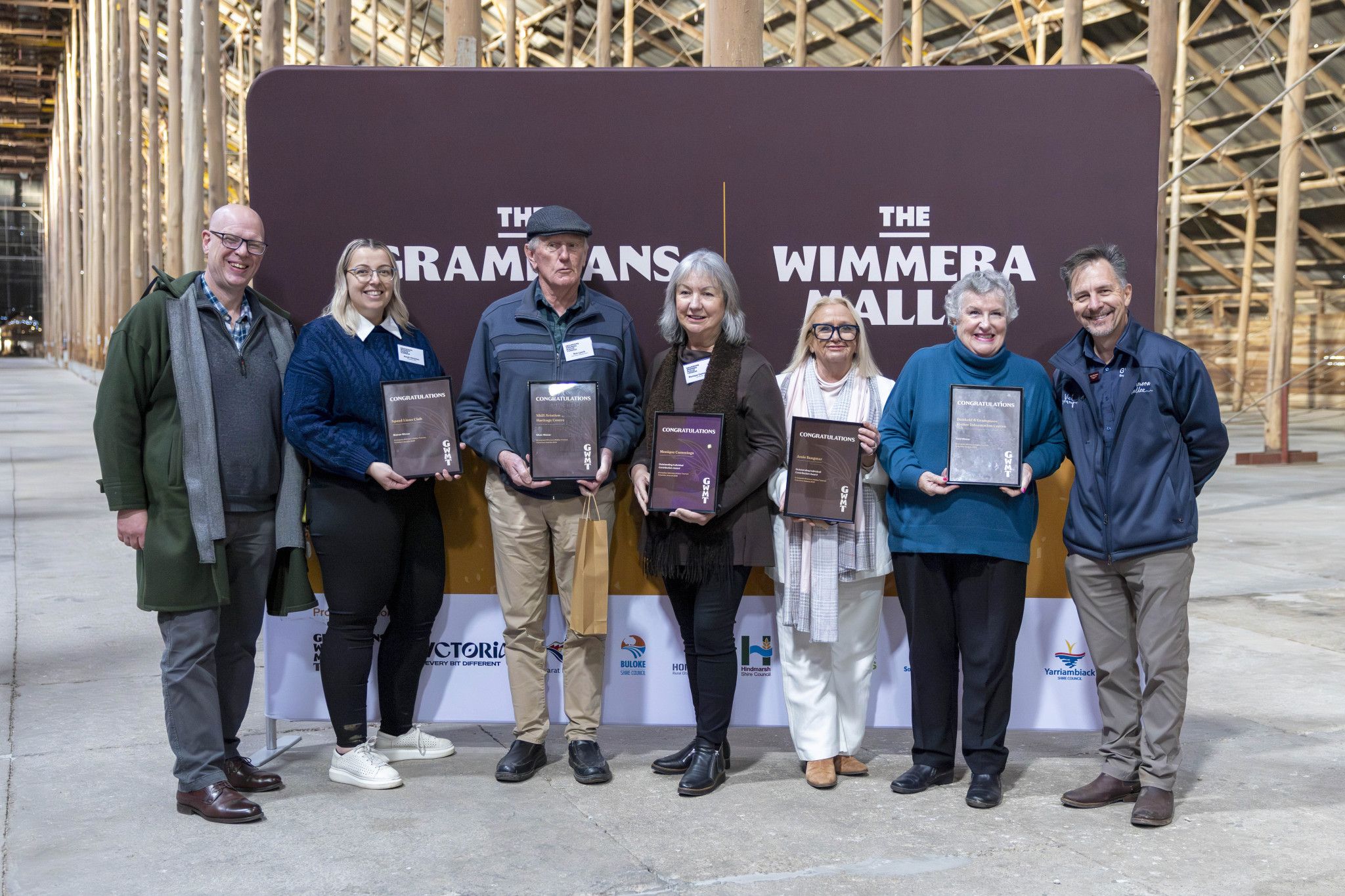 Award recipients and presenters gathered at the Grampians Wimmera Mallee Tourism Volunteer Summit and Recognition Awards at the Murtoa Stick Shed. Geoff Sharp (left), Sarah Christian, Rob Lynch, Monique Cummings, Josie Sangster, Mary-Ann Brown, and Marc Sleeman.