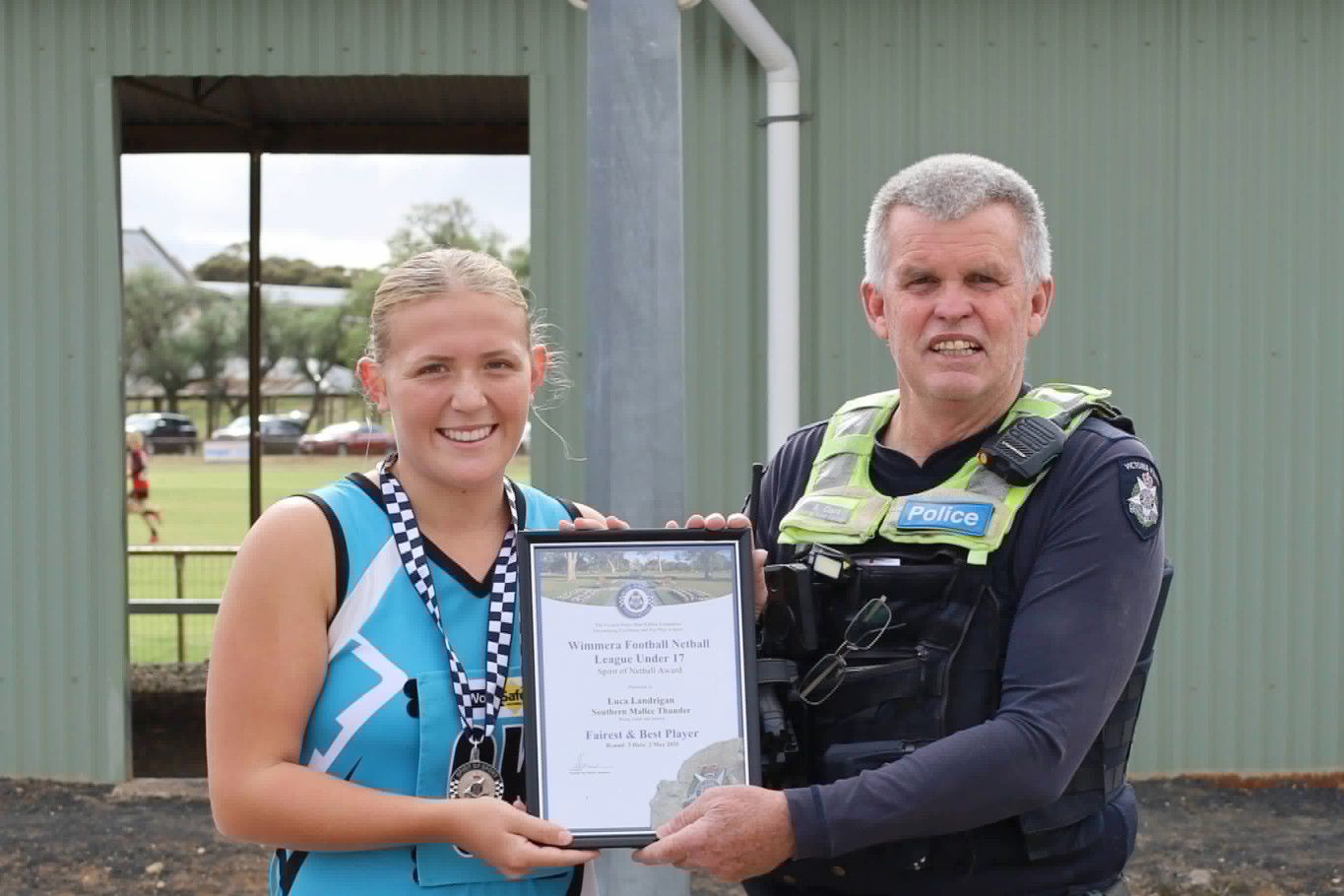 Southern Malle Thunder netballer Luca Landrigan with Leading Senior Constable Tony Clark.