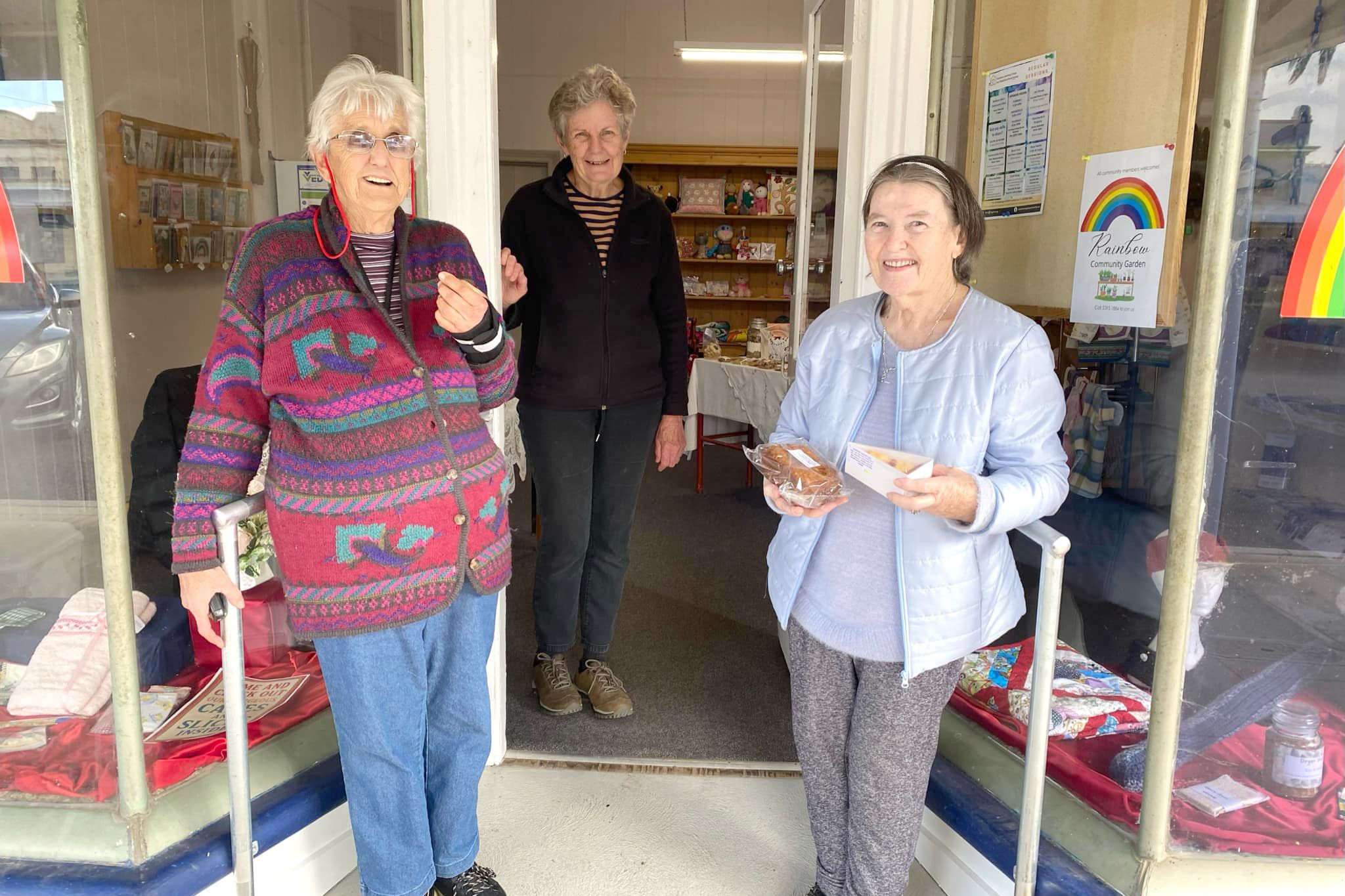 Elaine Abbott, with volunteers Ruth Gosling and Dot Austin, is all smiles after the installation of the new ramp and handrails to assist less-mobile members of the community.