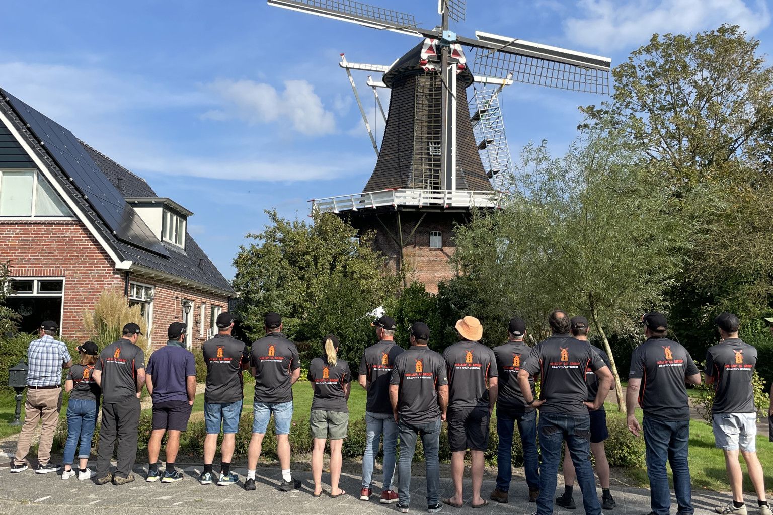 Pete Crafter, Felicity Pritchard, Lindsay Knight, Karl Schmidt, Mark Gaulke, Josh Cook, Anna Johansson, Ceus Wolthuis, Davis Lutze, Tim Inkster, Phil Pietsch, David Jochinke, Charlie Gardner, Russel Barber and Ben Lawson check out a historic windmill used as a grain mill at Loppersum.