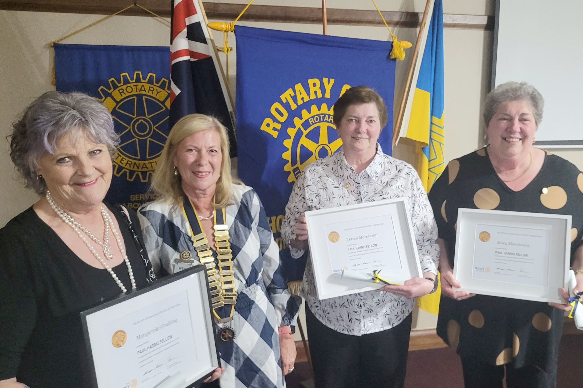 Paul Harris Fellow recipients Marguerite Goulding and Teresa and Mary Marchesini with president Wendy Lang (second from left).