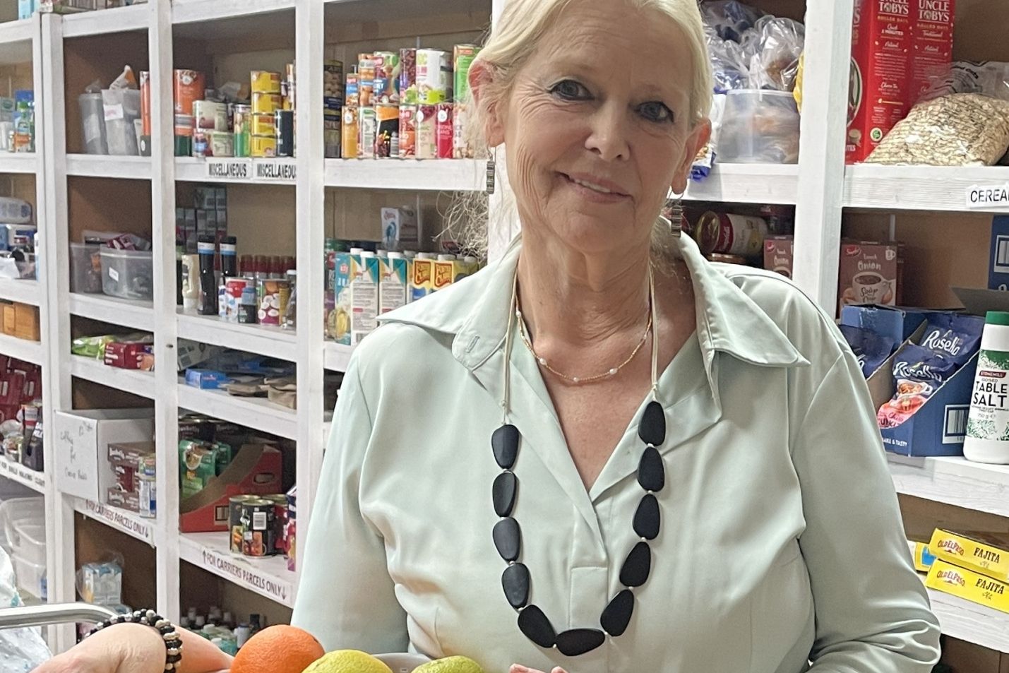 Bev Miatke in Christian Emergency Food Service's food room.
