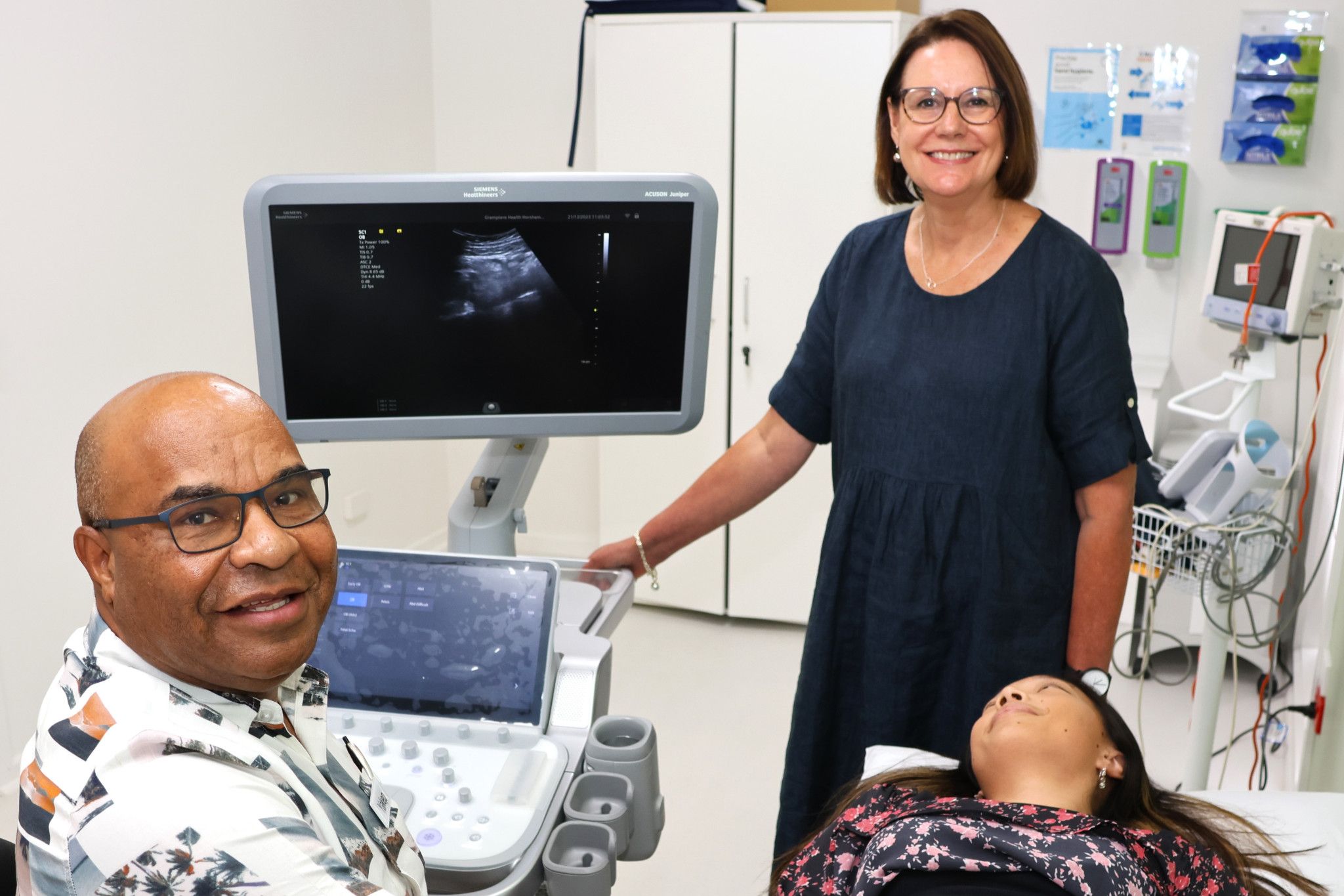 Grampians Health obstetrician Dr Yakep Angue shows Sue Frankham the new ultrasound machine.