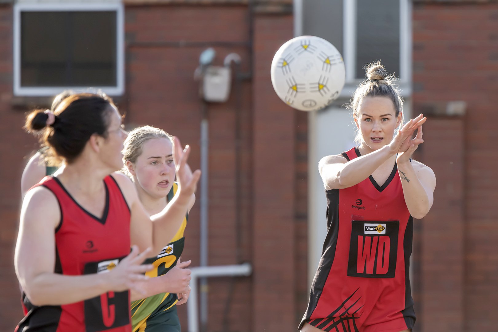 Rachel Wood passing to Jemma Clarkson. Both are co-coaches for 2024.