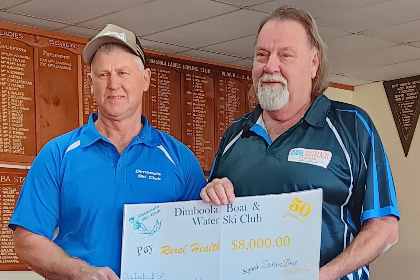 Dimboola Ski Club president Darren Bone presents a cheque to Rural Outreach Program worker Mal Coutts.