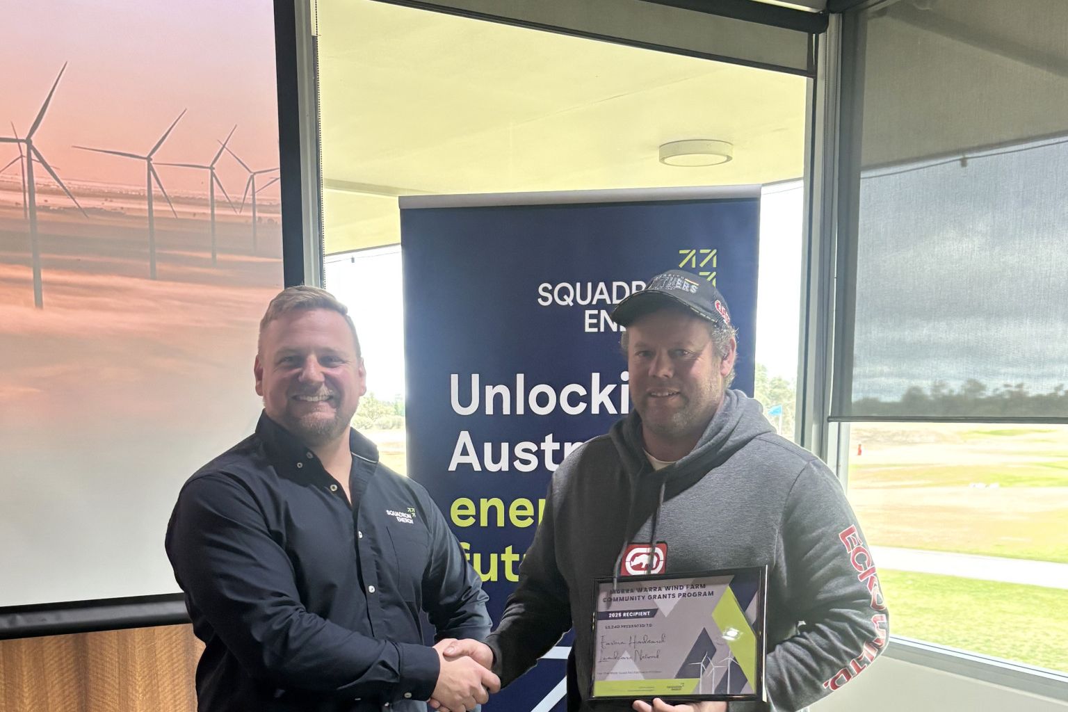 Daniel Paech, secretary of Eastern Hindmarsh Landcare Group, receiving his successful grant certificate from the representative of the Murra Warra Wind Farm.