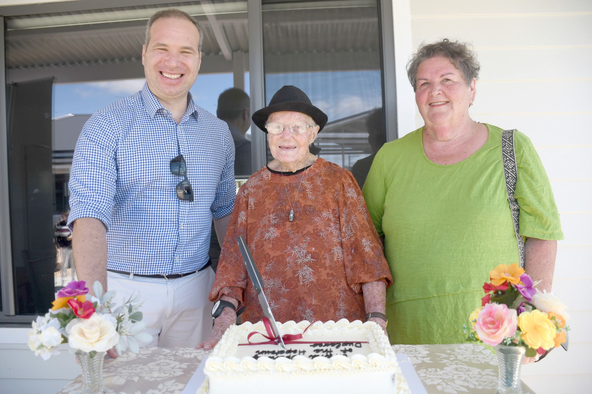 RNH Board member Michael Koss, former Hopetoun matron Una Splatt and RNH board member Jan Fisher cuts the cake on the official opening day.