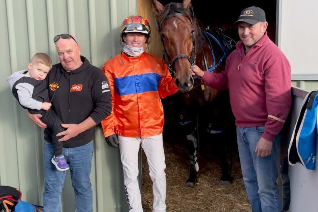 Horsham part-owner Alistair Brooksby and his son Harry with driver James Herbertson and trainer Justin Lane after The Naked Art's home-track victory.