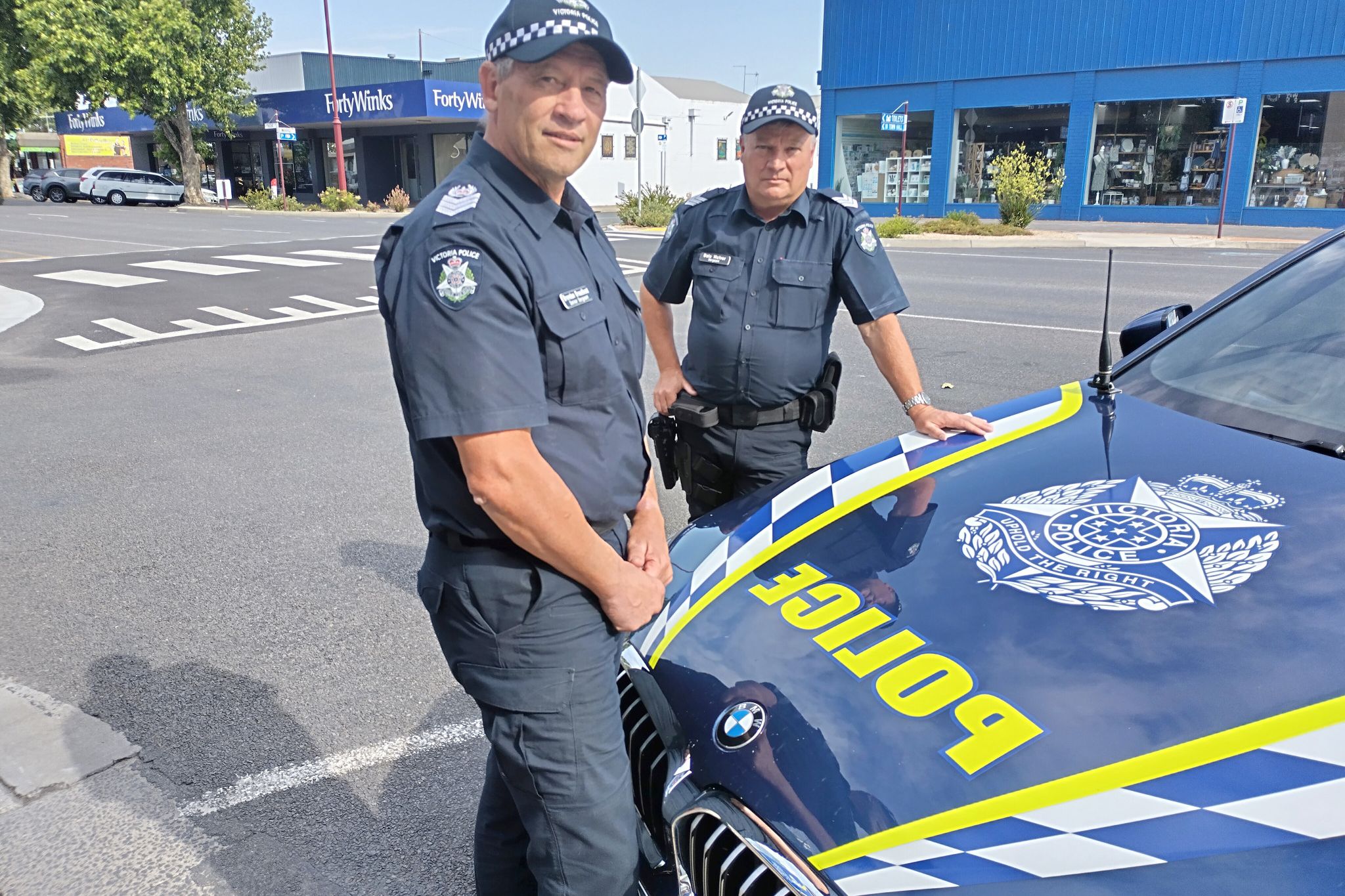 Senior Sergeant Brendan Broadbent and Sergeant Dale McIvor at the Pynsent Street crossing.