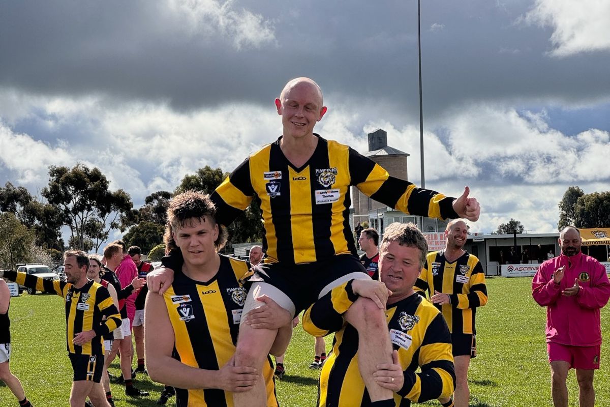 Aiden Lawson getting chaired off the ground.