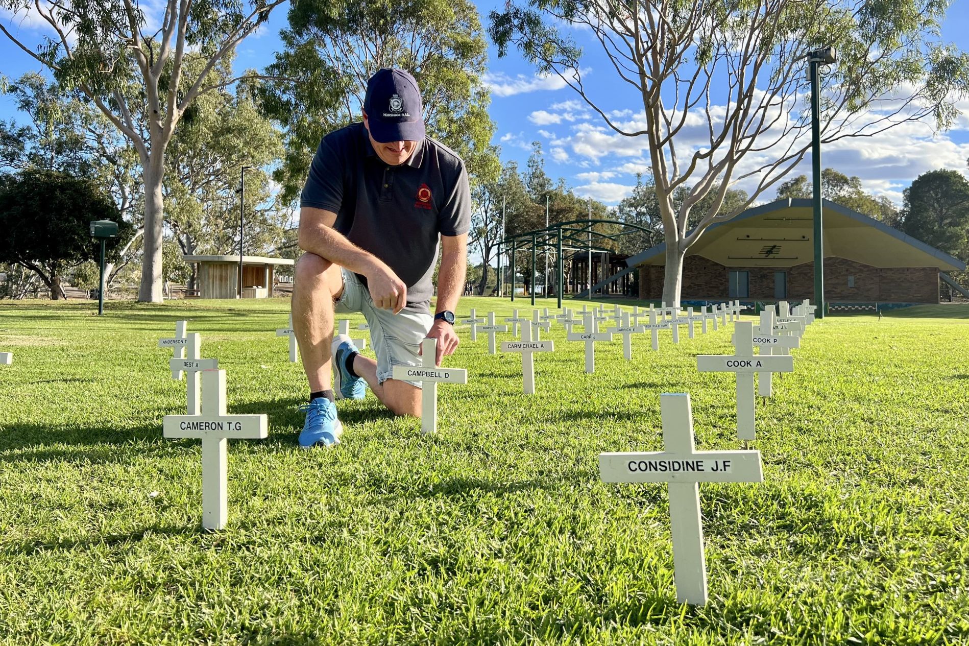 On Wednesday afternoon, Horsham RSL president Gareth Lane and other members laid down more than 400 crosses in Sawyer Park, each bearing the name of a local person who had participated in wars, conflicts, and peacekeeping missions around the world. Photo: TAYYAAB MASROOR