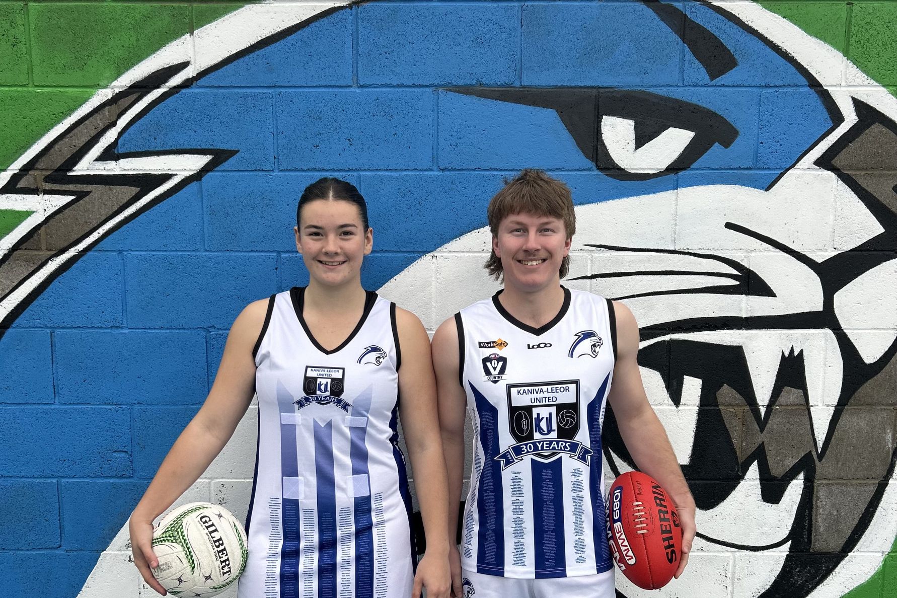 Ruby Gordon and Xavier Stimson showcase the playing outfits that Kaniva Leeor United players will wear this weekend as they celebrate 30 years of amalgamation this Saturday July 25.