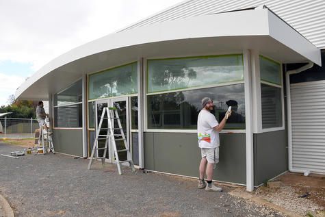 TJ Parish and Dale McMaster from McMaster Painters, put the finishing touches to the exterior of the new Rupanyup Library recently. Photo: DAVID WARD