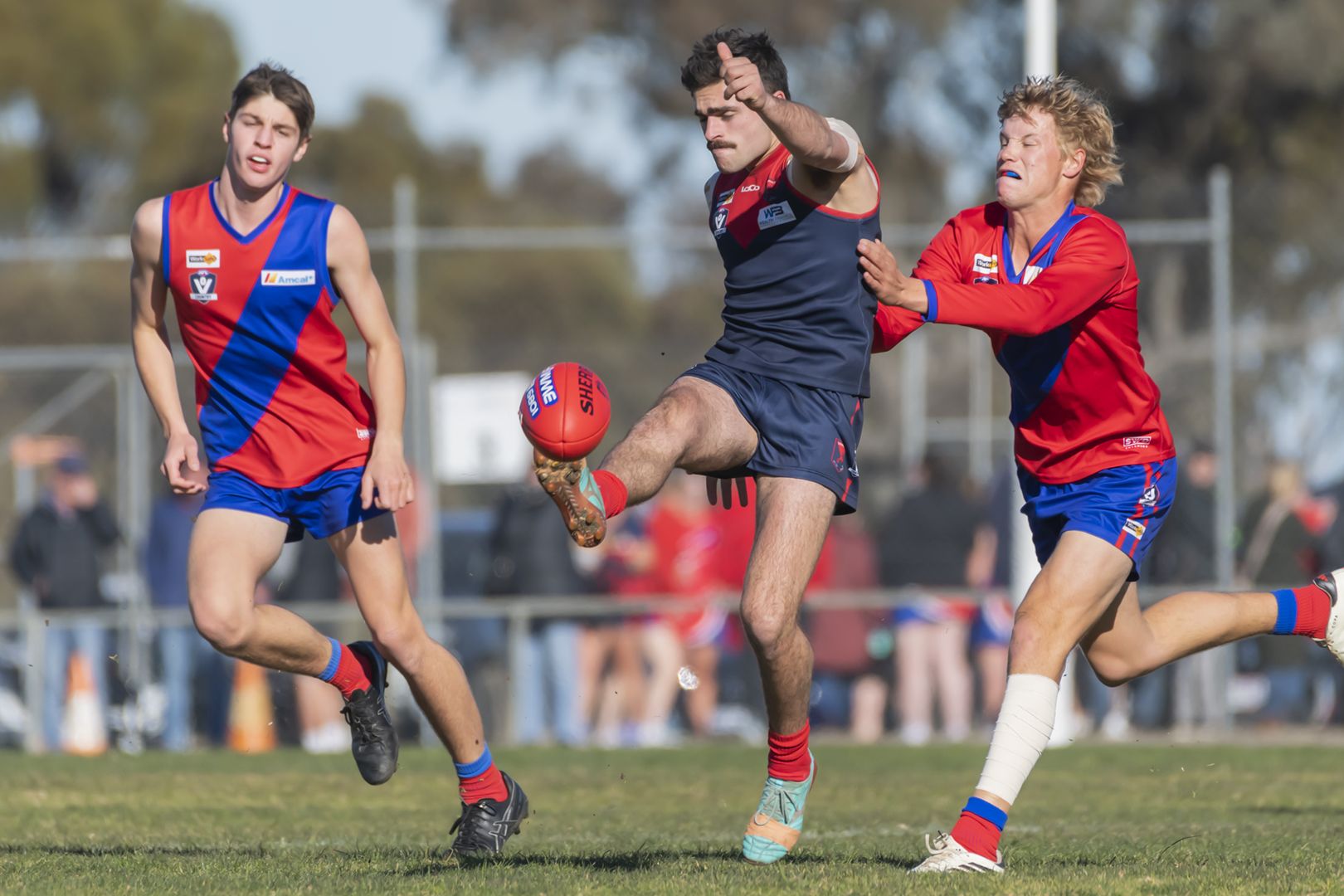 Demons Pat Lattanzio gets a kick away. PHOTO: SHANE ROBERTS