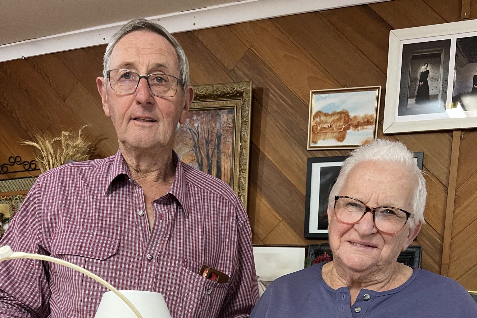 Wal Ferguson and Alice Gove with their creations made from recycled microwave rings and old lace curtains.