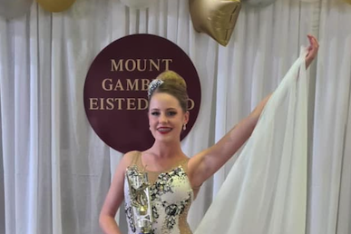 Bonnie Grieger beaming with her 1st place trophy from her 14 year Graceful Solo performance
