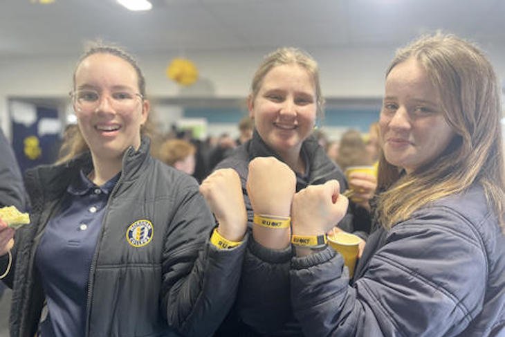 Imogen Dumesny, Tiffany Petering and Mia Frawley with their wristbands from the Doctors in Schools program. Photo: EMILY FRIEDRICHSEN