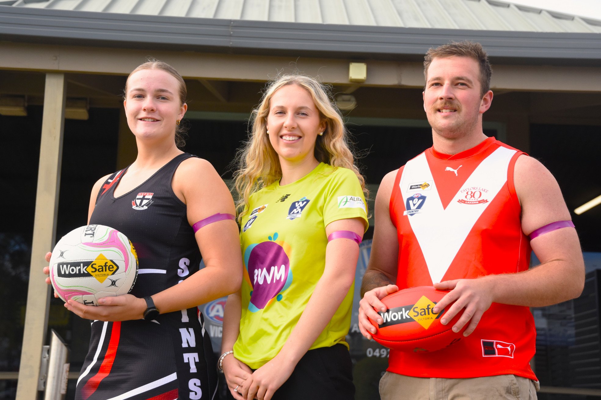 Horsham Saints' Jorja Clode, Wimmera Mallee umpire Chloe Haughton and Taylors Lake's Ryan Gebert wear armbands ahead of this Saturday's Are You Safe at Home? Round to raise awareness of family violence.