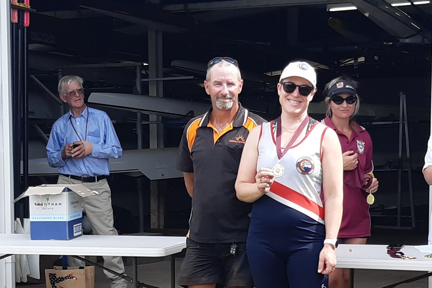 Sarah Tottenham receiving her Medal from race sponsor Curlwaa Caravan Park.