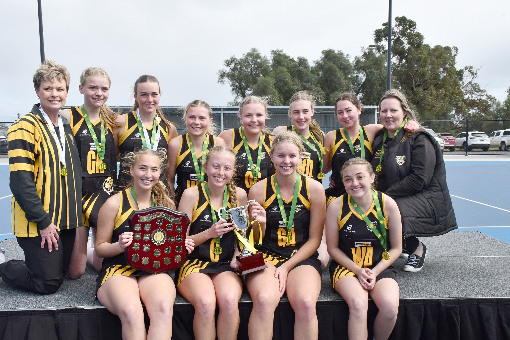 Pimpinio under-17 netballers celebrate their premiership.