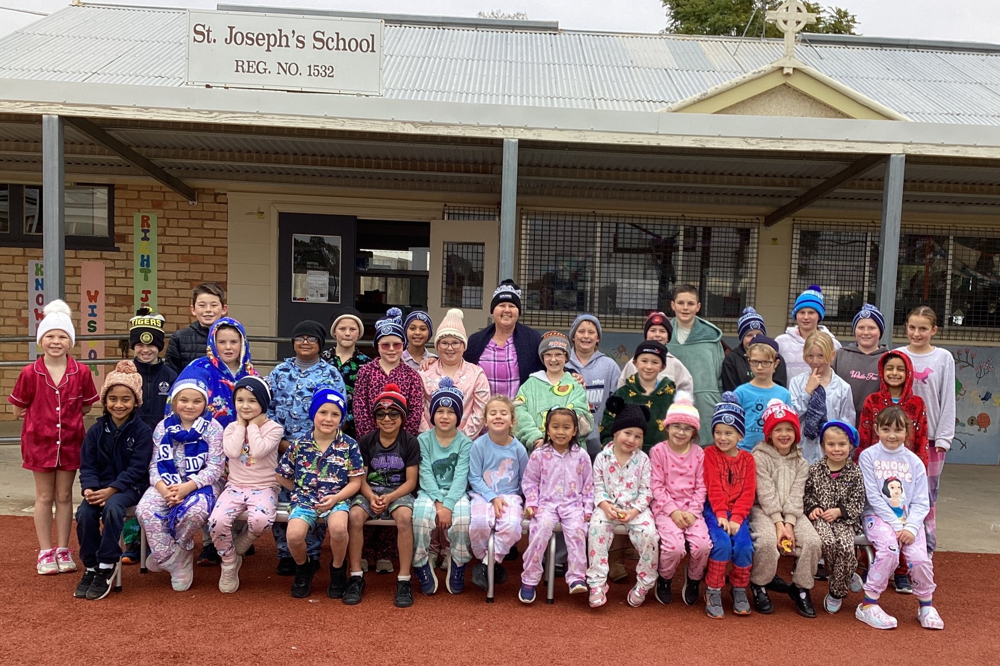 St Joseph Primary School kids with principal Cynthia Maiden in the middle on PJ and Beanies Day last Friday, June 27.