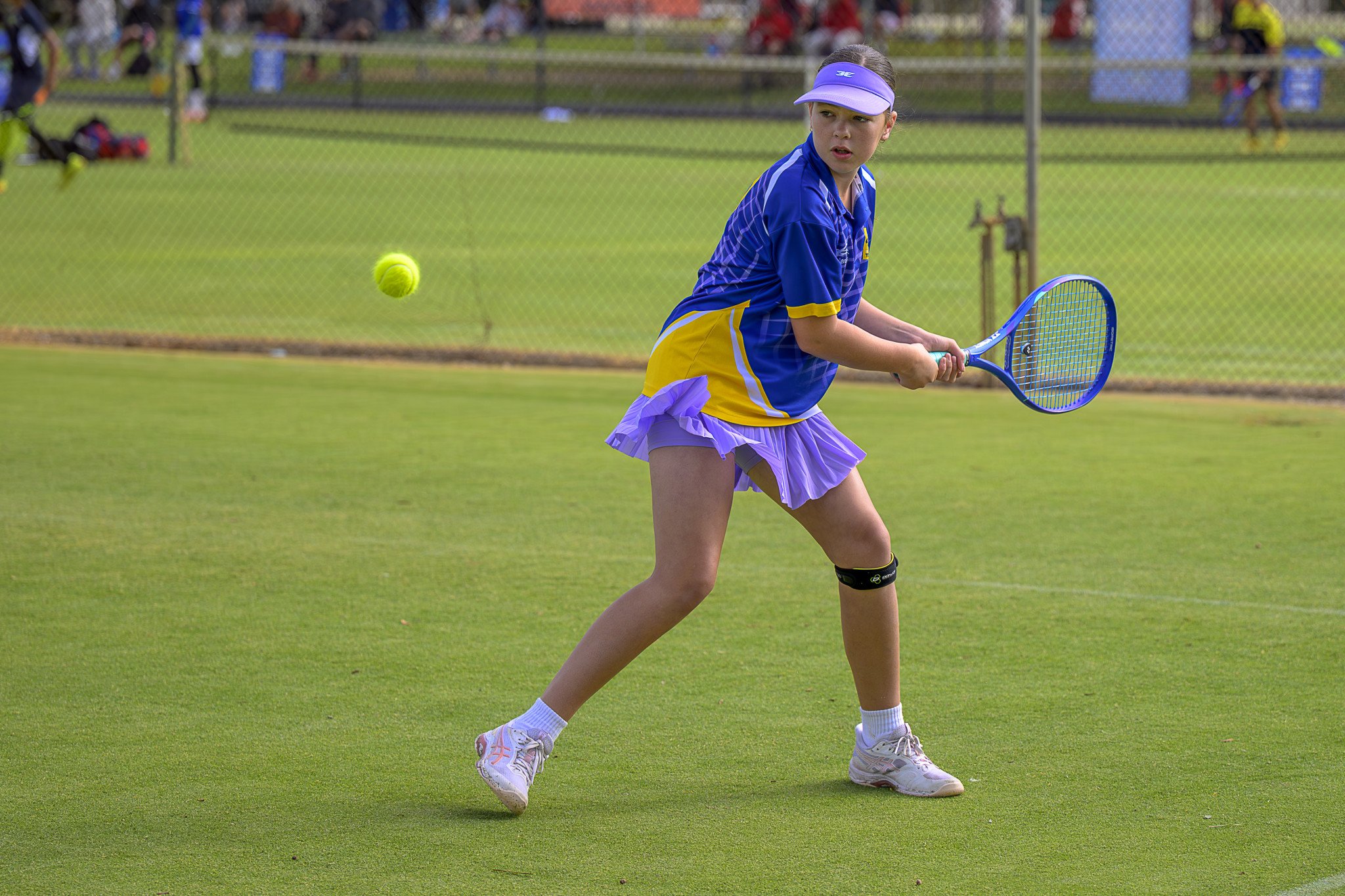 Olivia Robertson keeps an eye on the ball as she prepares a backhand.